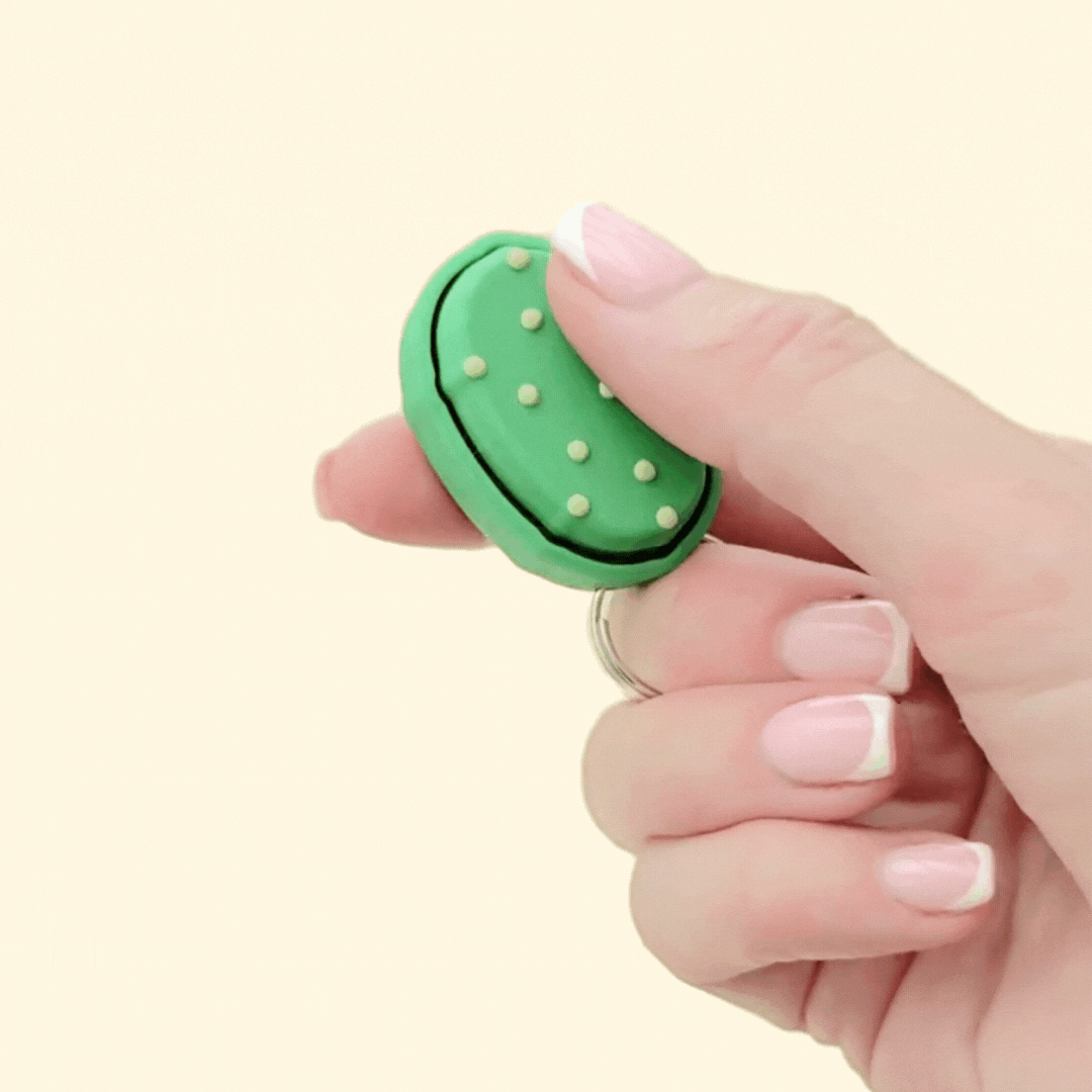 Clickle fidget toy with press-to-click top and bold texture for everyday sensory input.