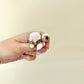 Small pastry-style turtle fidget with smooth glaze and textured details for tactile play.
