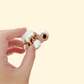 Small pastry-style turtle fidget with smooth glaze and textured details for tactile play.
