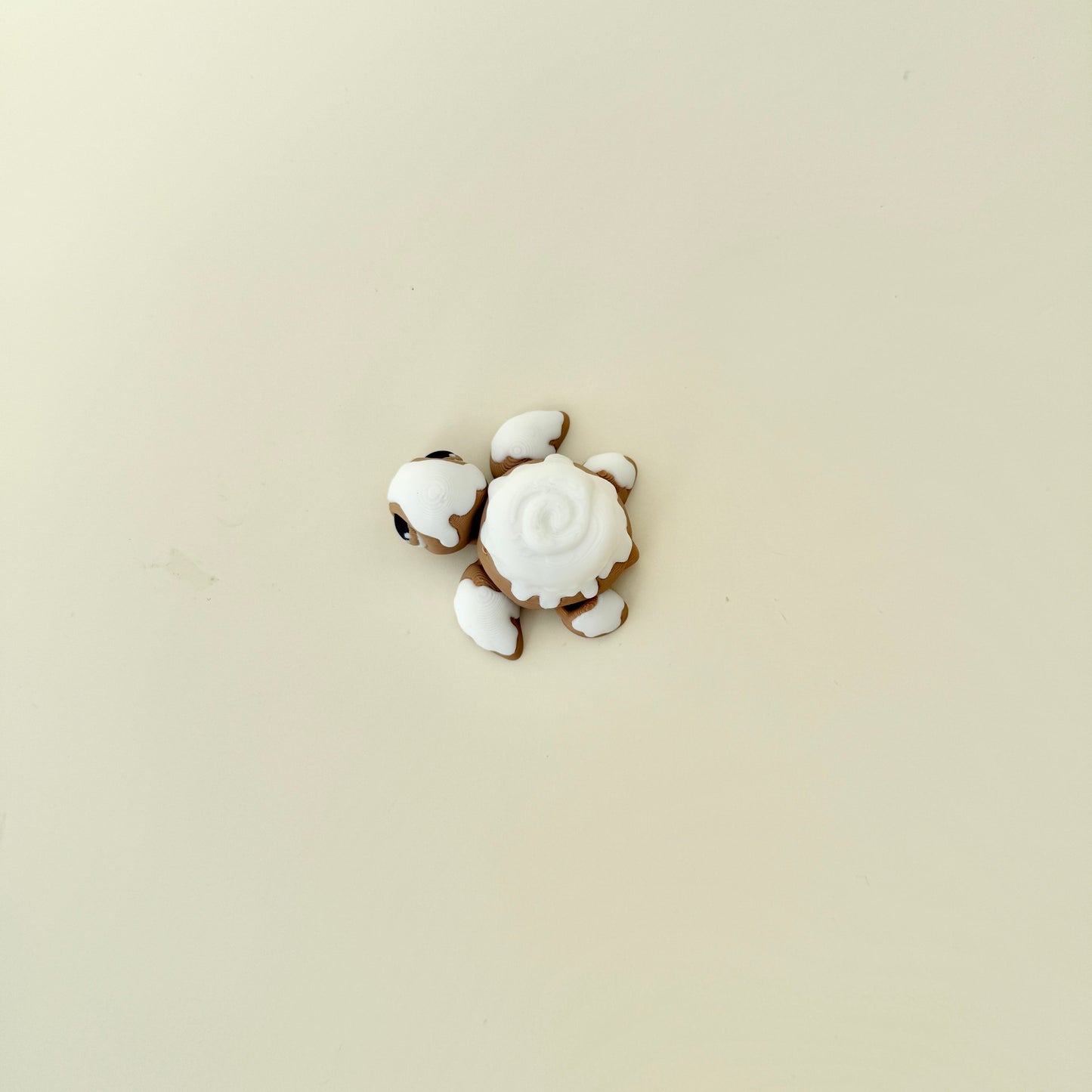 Handheld turtle fidget featuring mixed smooth and raised textures for sensory input.
