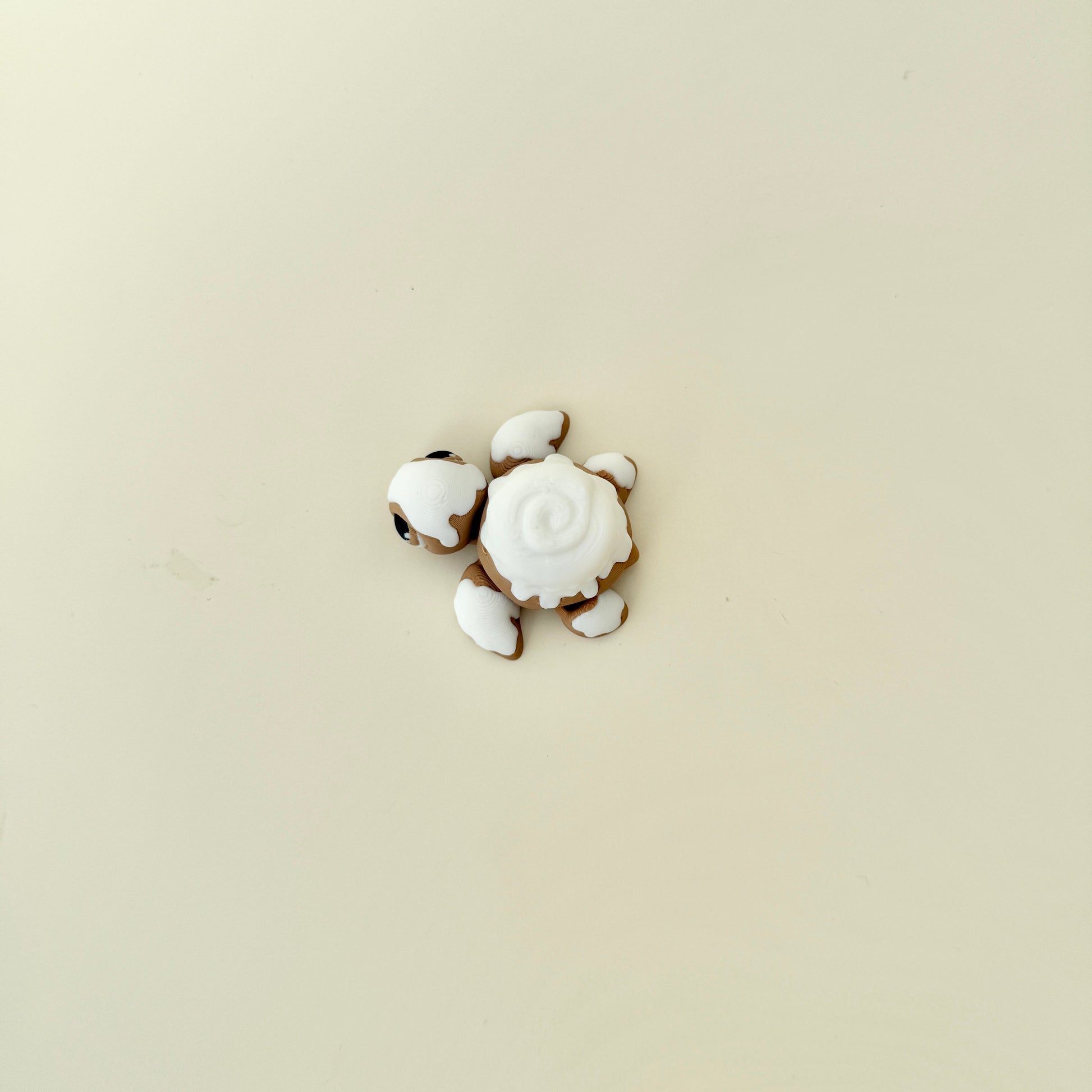 Handheld turtle fidget featuring mixed smooth and raised textures for sensory input.
