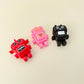 Small robot fidget with built-in loop for bags, lanyards, and keys.
