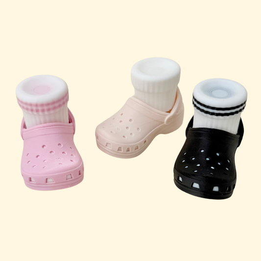 Mini shoe clicker with push-down sock action, compact fidget design, custom colours, pocket-friendly sensory toy.
