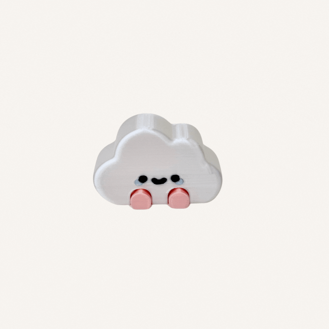 Cute mini cloud character with dangling legs and shiny finish designed for desks, shelves and calming decor spaces
