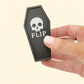 Magnetic fidget tiles with textured and smooth sides, shown beside a matching coffin case.
