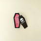 Handheld magnetic snap fidgets with coffin-shaped storage case on neutral background.
