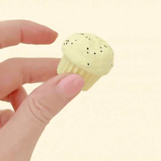 Palm-sized muffin fidgets designed for tactile clicking and visual appeal.