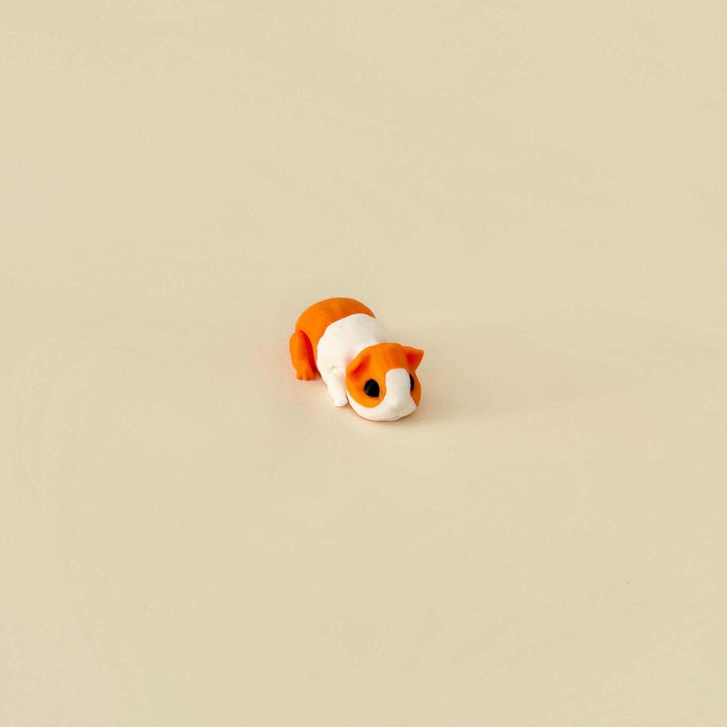 A collectable guinea pig sensory toy with lifelike details, available in two colours.