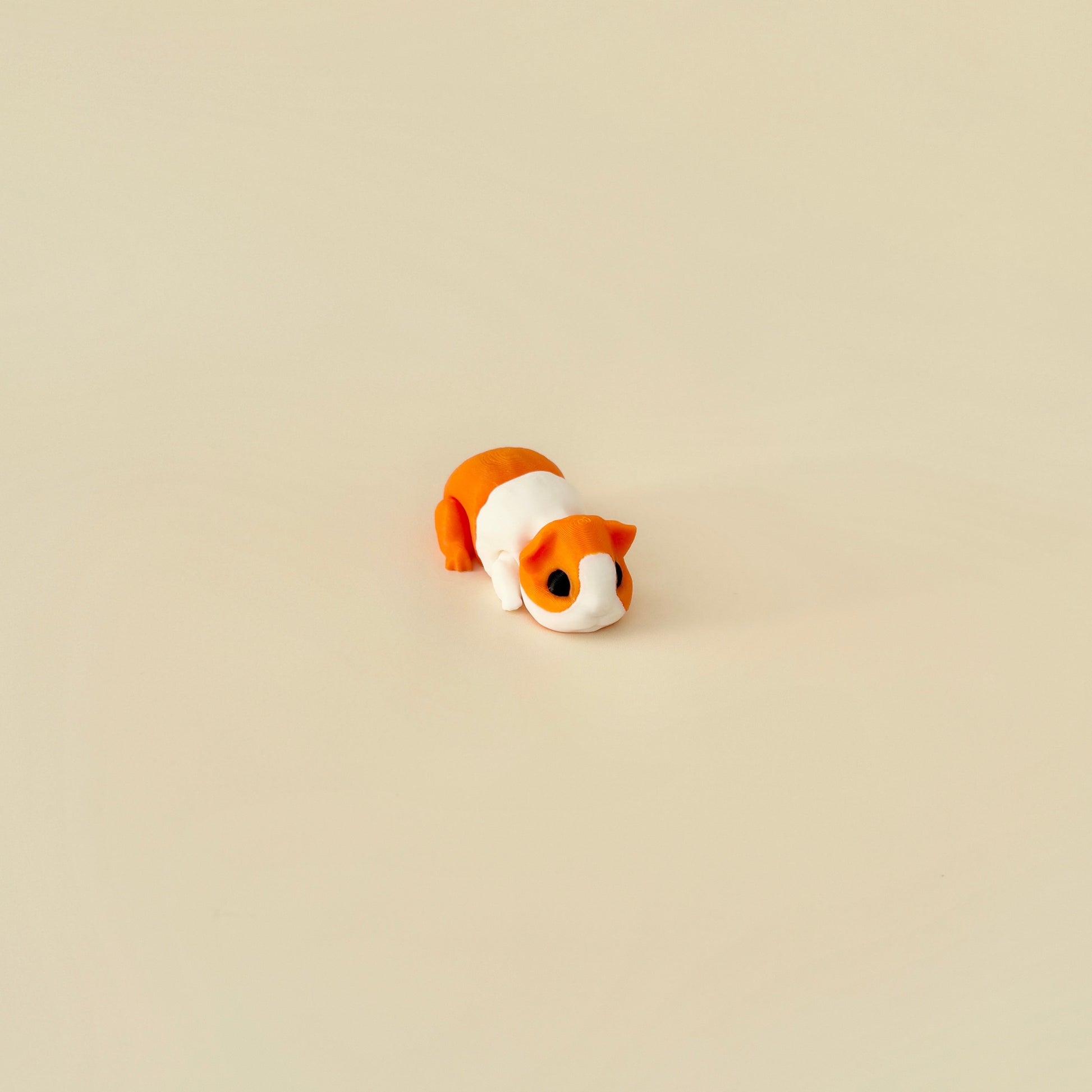 A collectable guinea pig sensory toy with lifelike details, available in two colours.