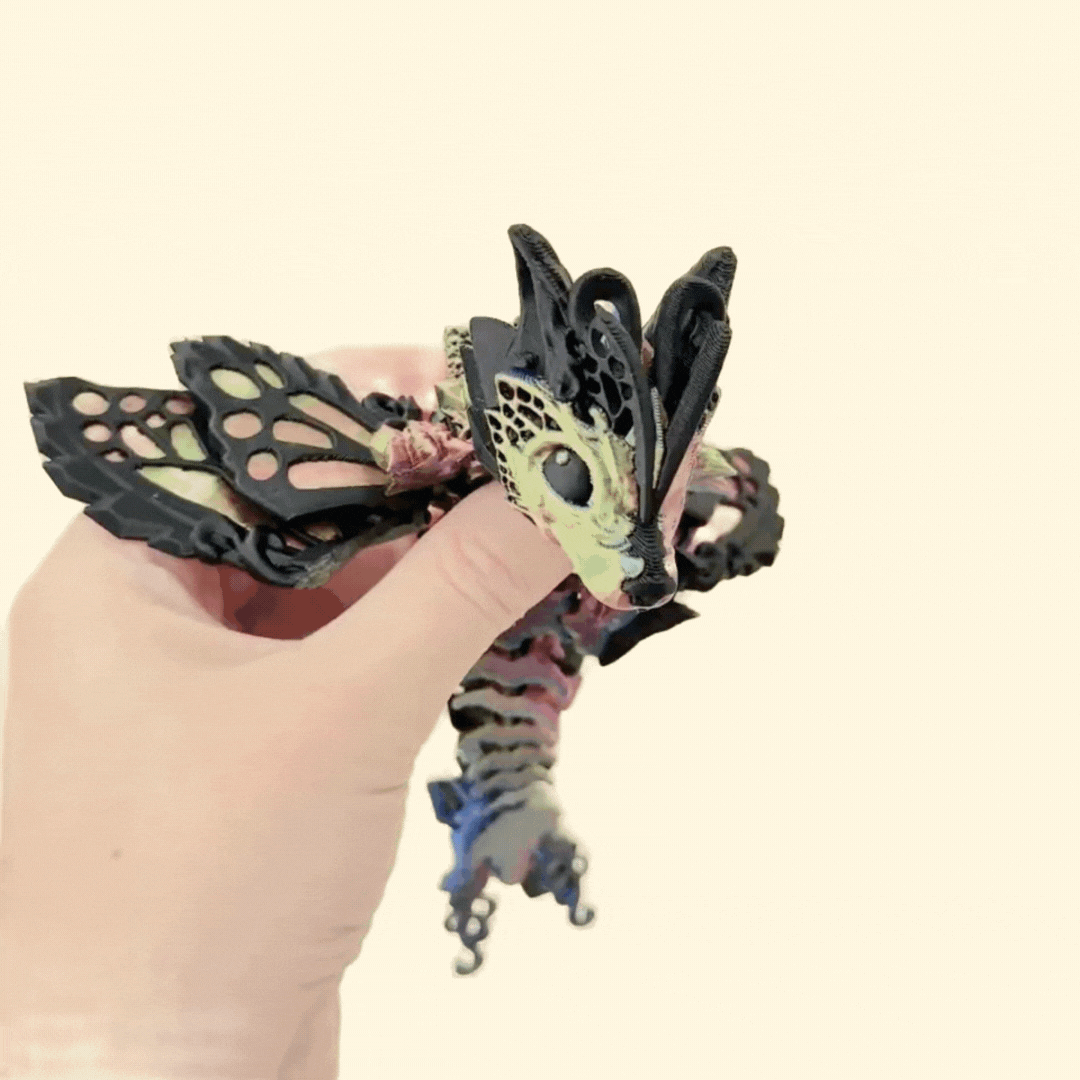 Fully articulated dragon with colour-shifting gold, green, and purple accents