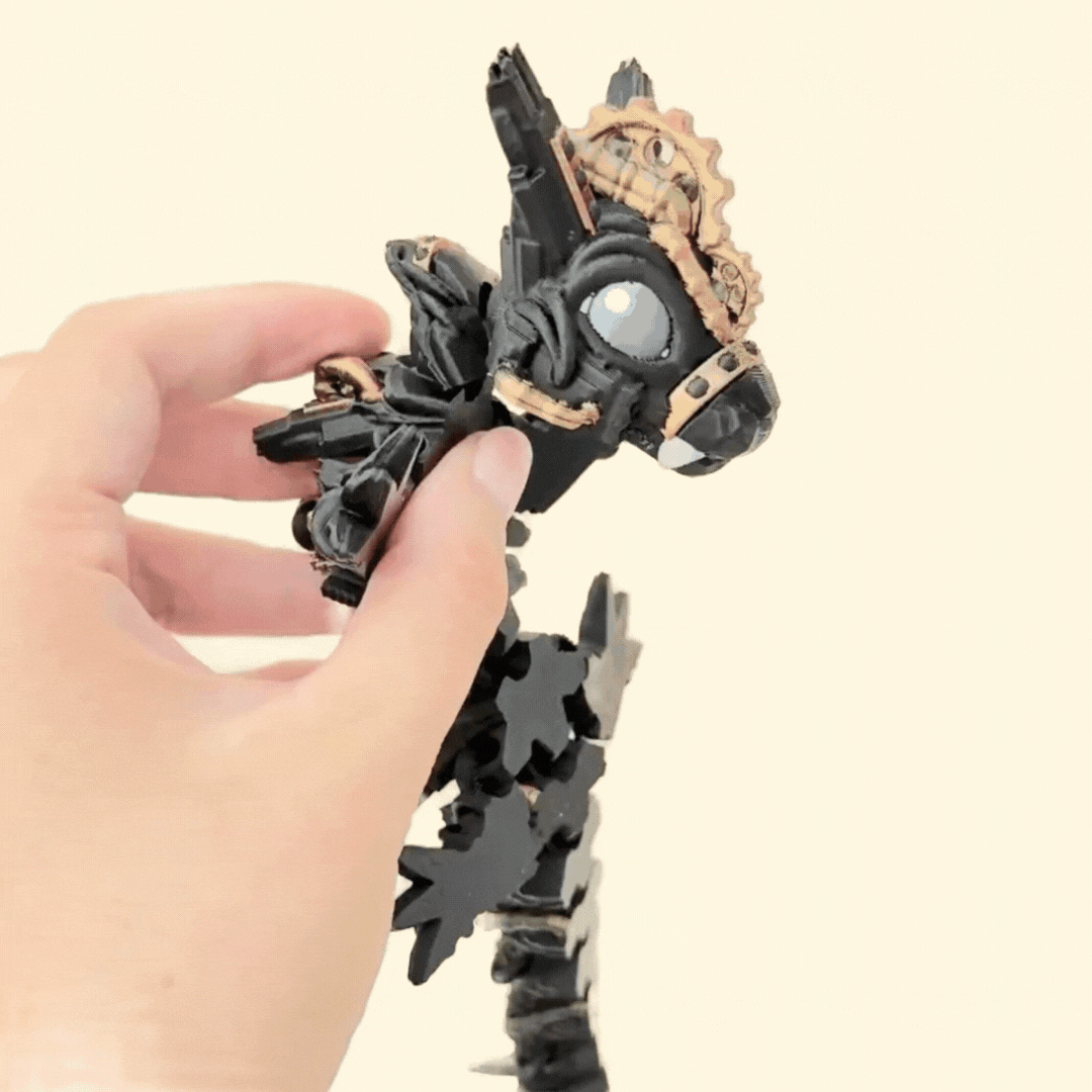 Detailed fidget dragon finished in black and bronze-gold colour-changing filament, designed for movement and texture