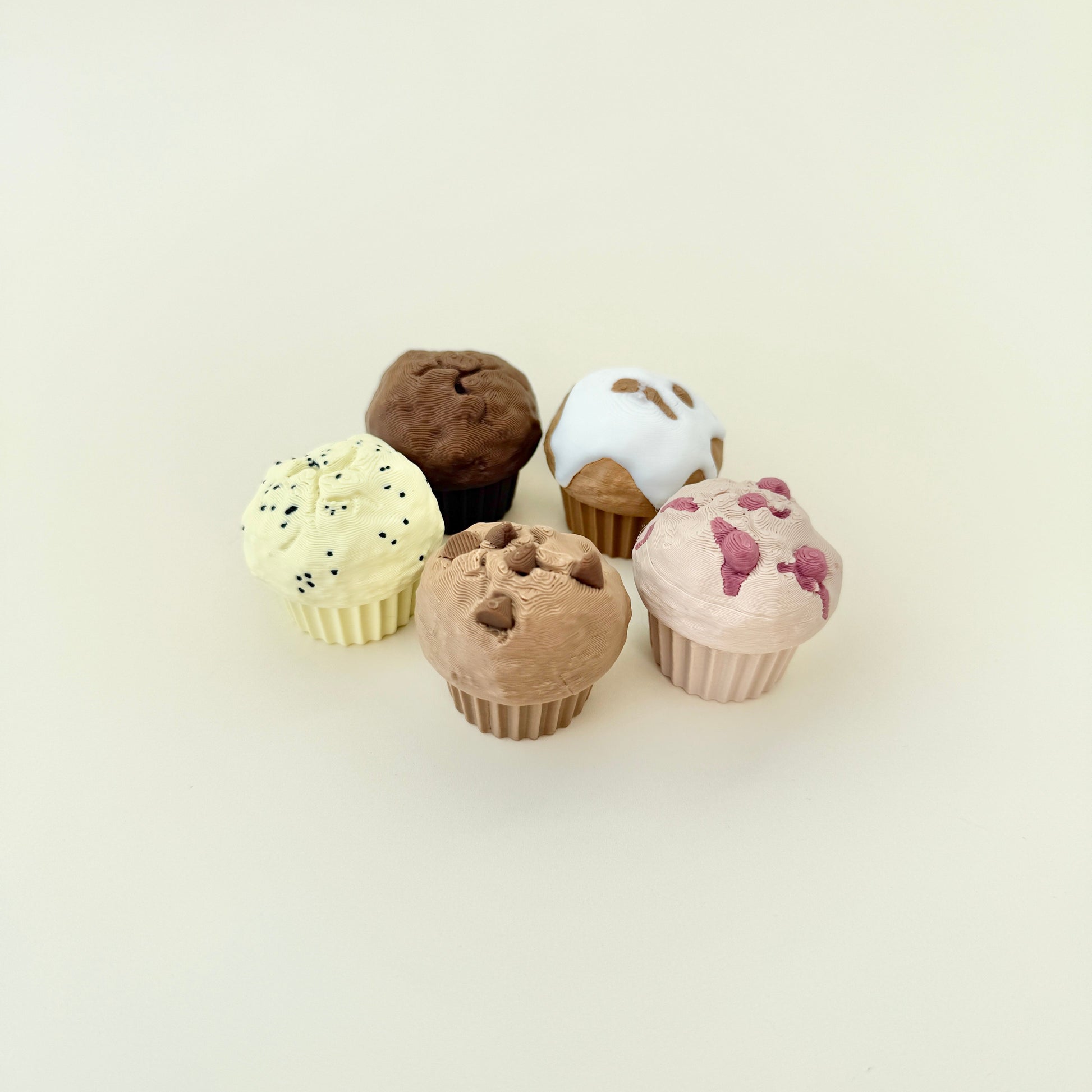 Small muffin-shaped fidget toys that click when pressed, ideal for quiet stimming.