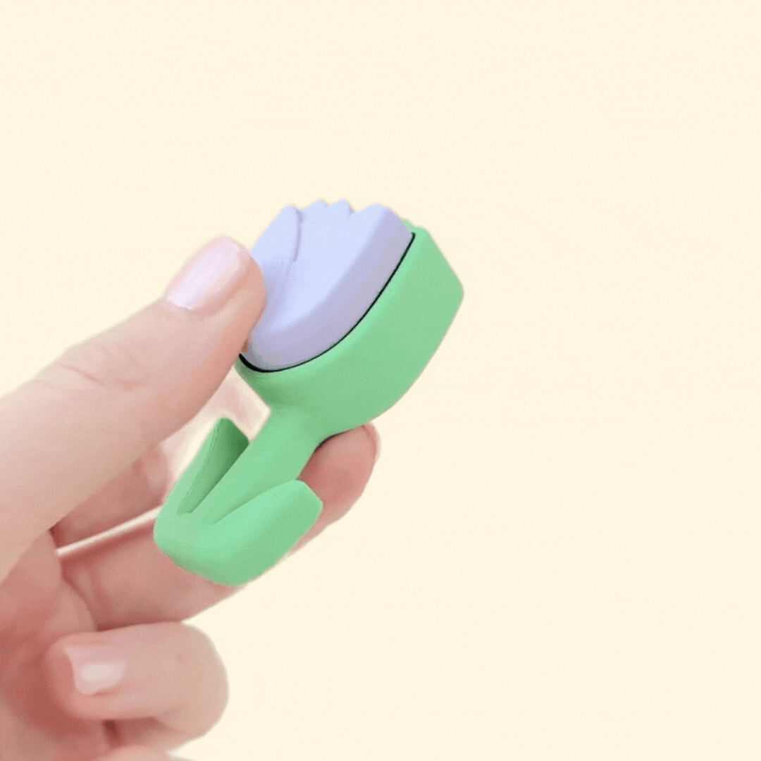 Small tulip-shaped fidget toy in lilac and green, perfect for on-the-go stress relief and focus.