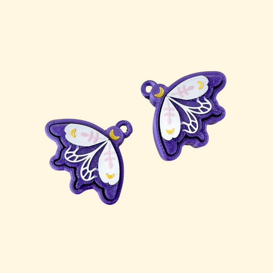 Small purple clicker with wing design, suitable for sensory use and daily fidgeting