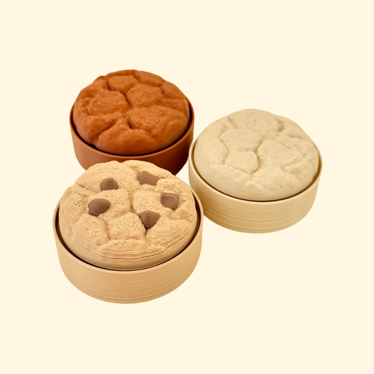 Textured cookie-shaped clicker fidget designed for press-down clicking and tactile sensory input.
