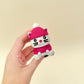 Cute cat-shaped fidget clicker with knitted winter outfit
