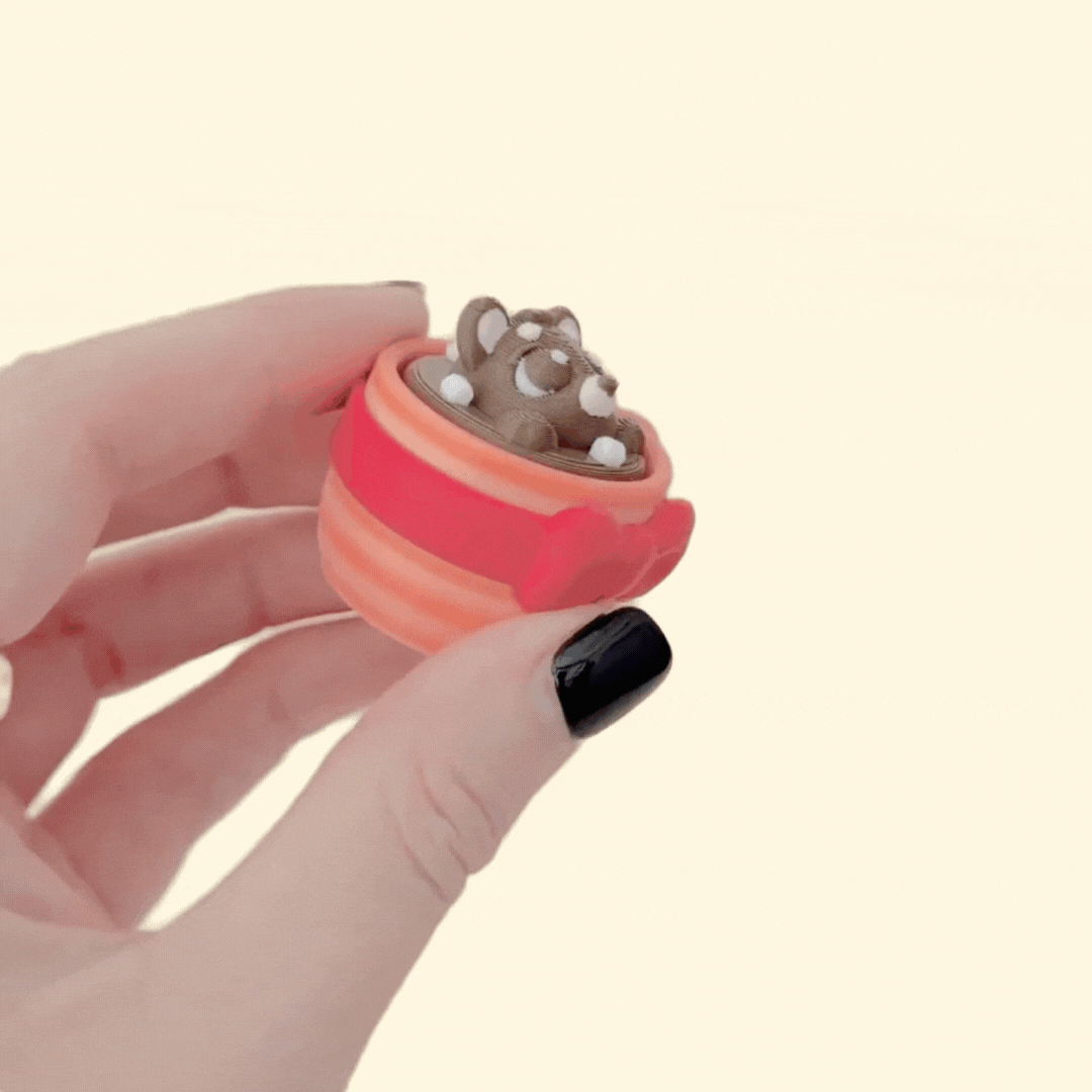 Festive hot chocolate fidget cup with raised topping for sensory clicking.
