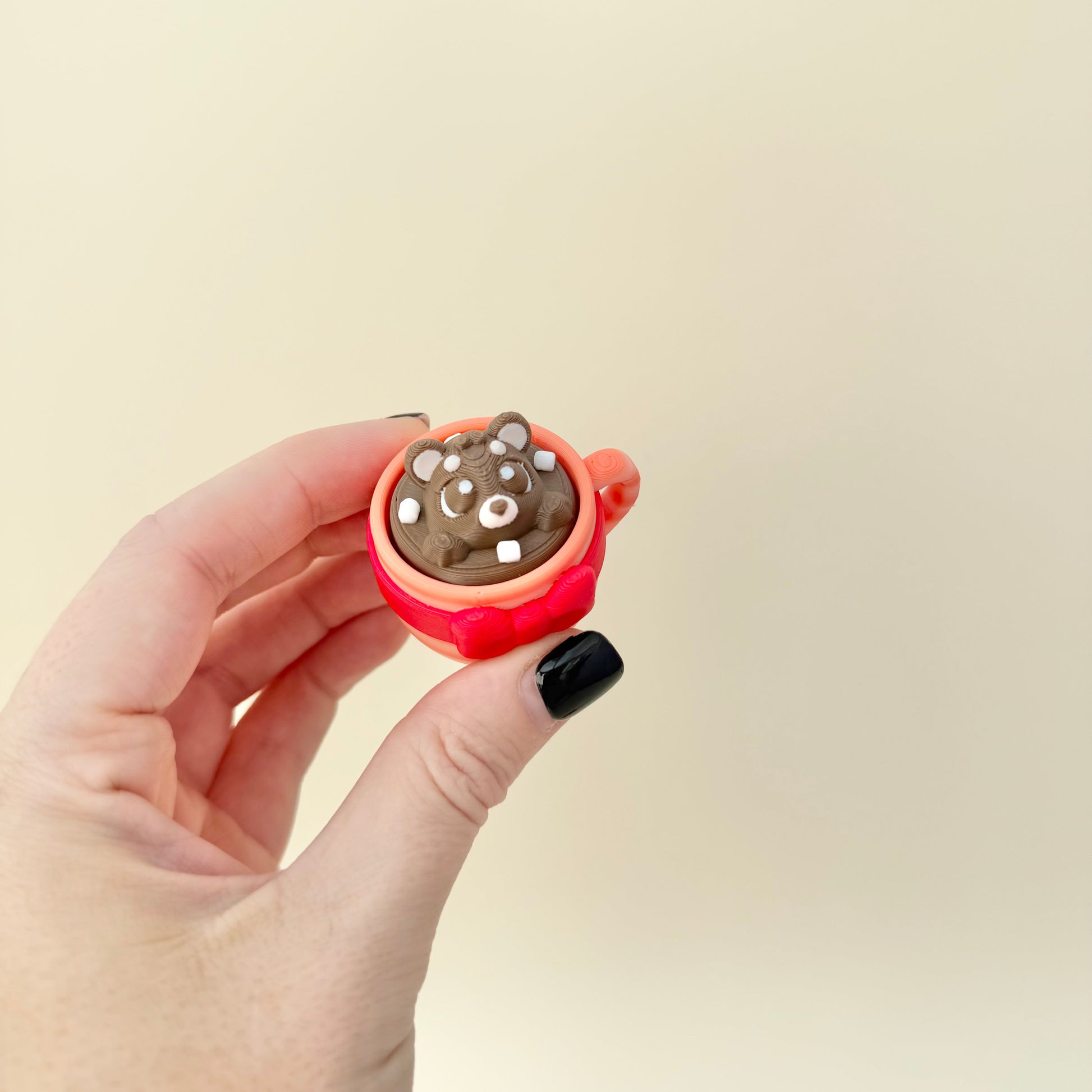 Cute Christmas hot chocolate stim toy with mixed textures for thumb tracing.

