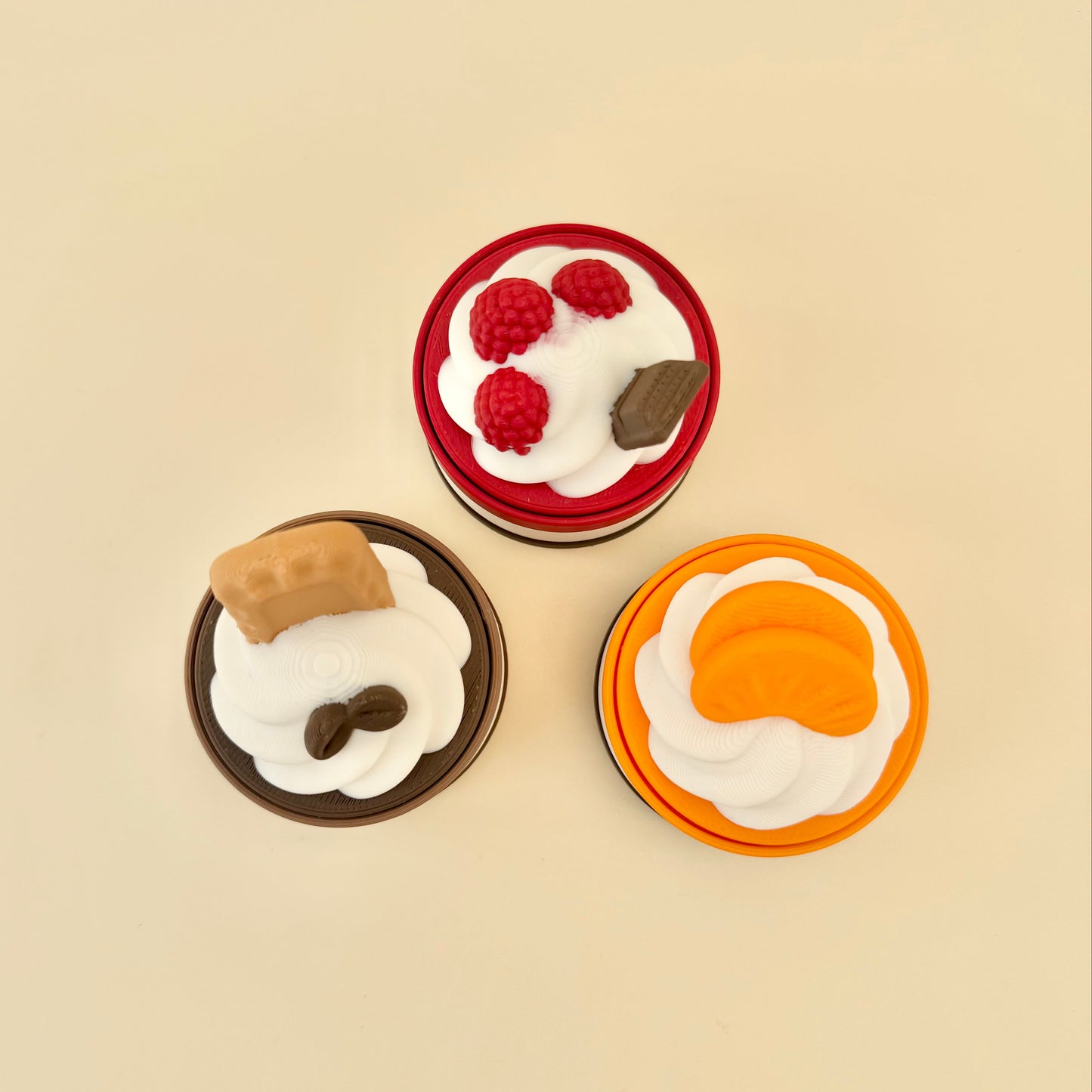 3D printed cake-shaped clicker fidget with press-down top, tactile frosting detail and optional quiet click upgrade.
