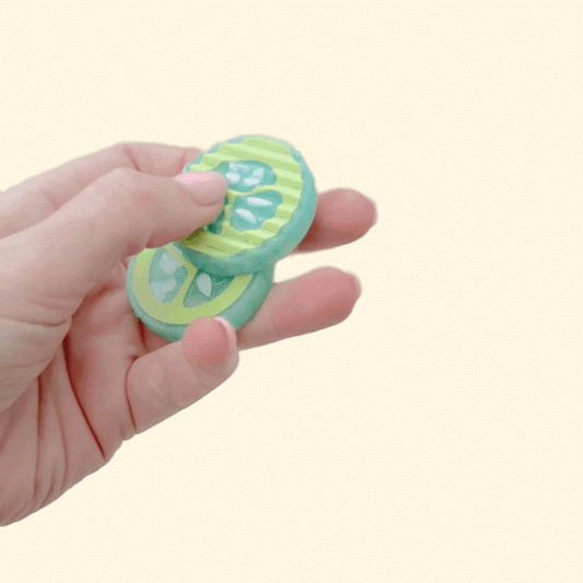 Magnetic pickle slice fidget with crinkle-cut ridges and bumpy texture for intense tactile input.
