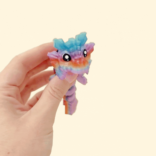 Articulated sensory dragon toy with smooth movement and crystal-style detailing for fidgeting and display.