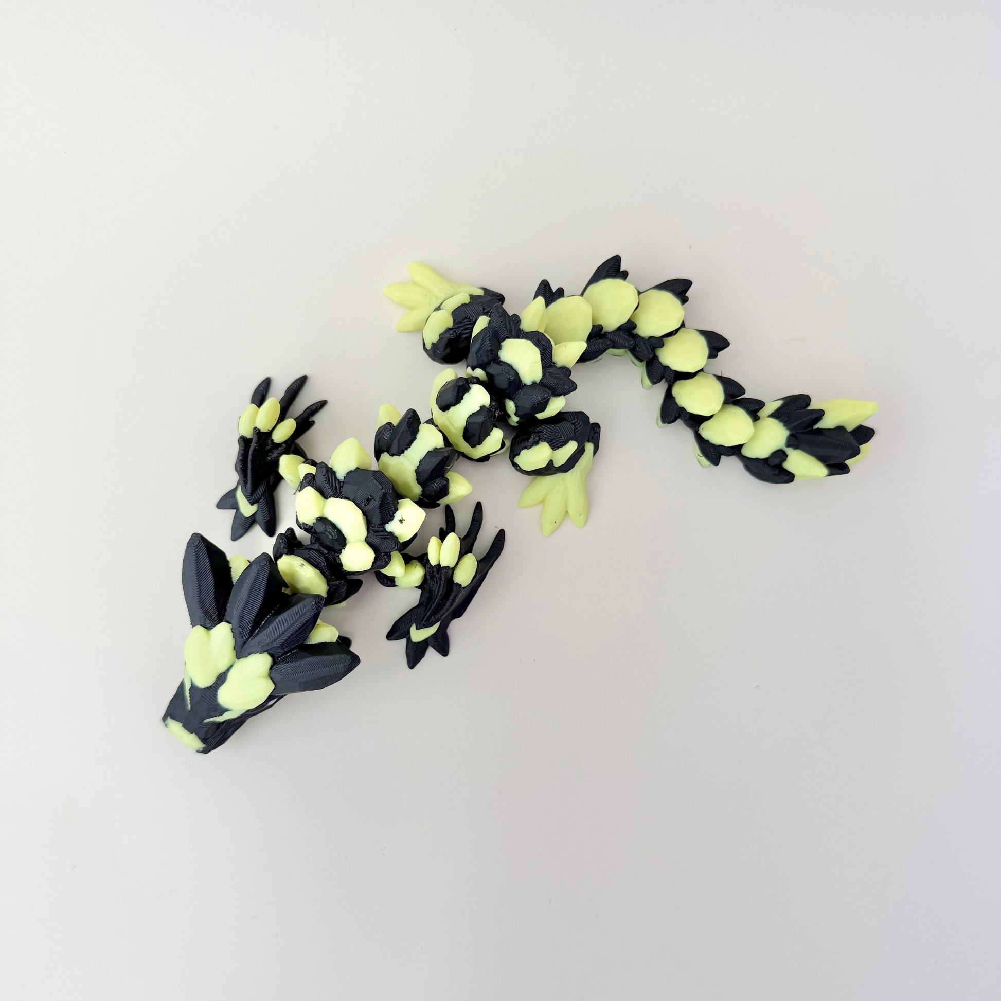 Fully articulated dragon that curls, poses, and moves smoothly in hand.
