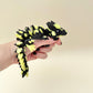 Glow-in-the-dark yellow/green crystal-textured articulated dragon with black accents.
