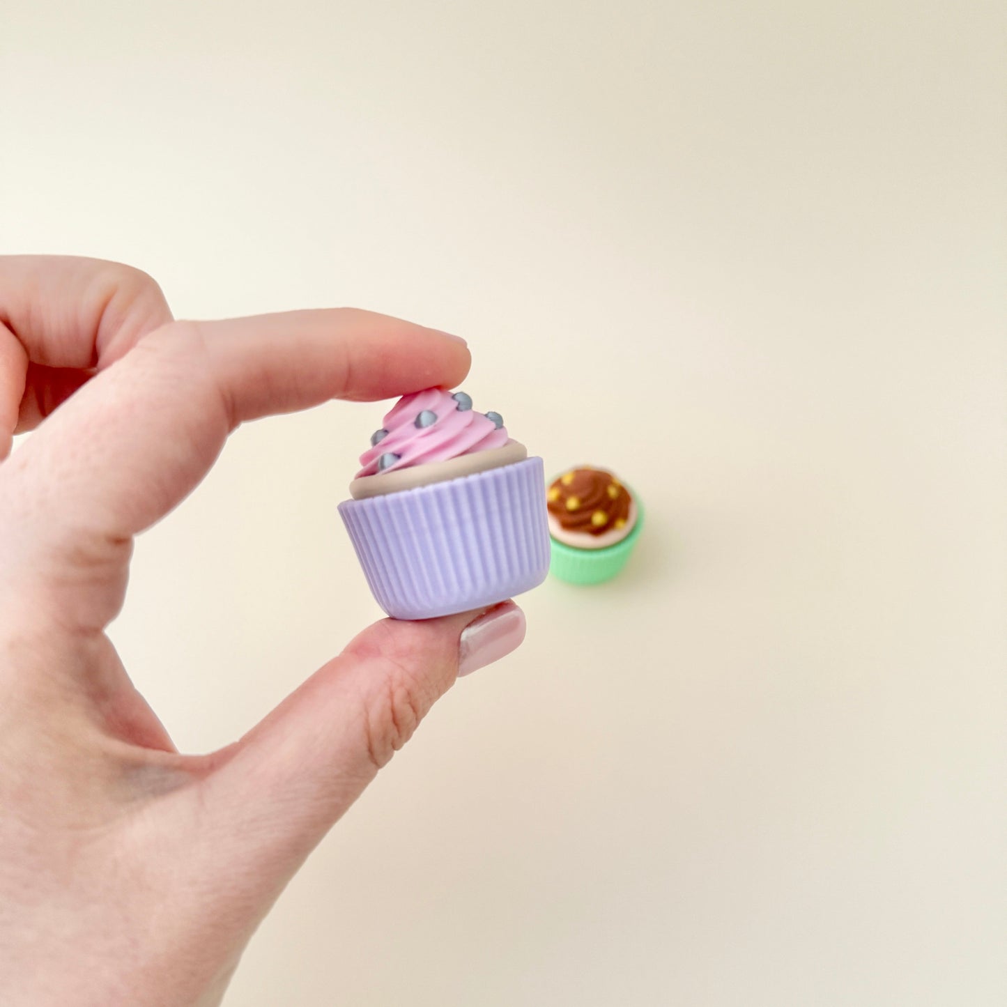 Demonstration of a cupcake clicker being pressed, making a satisfying clicking sound.