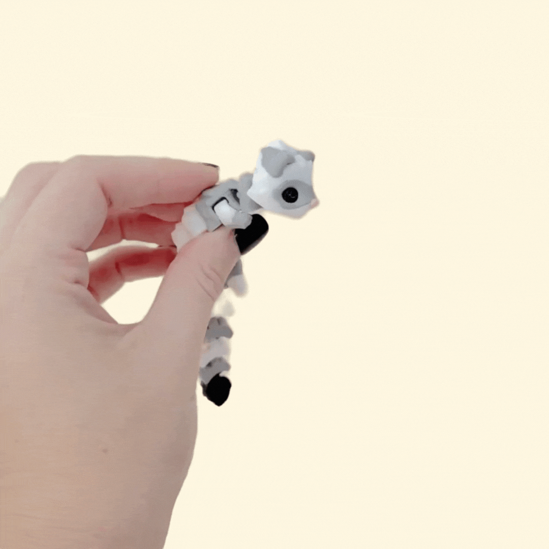 Sensory ferret fidget with movable segments and smooth flow; lightweight and easy to carry every day.
