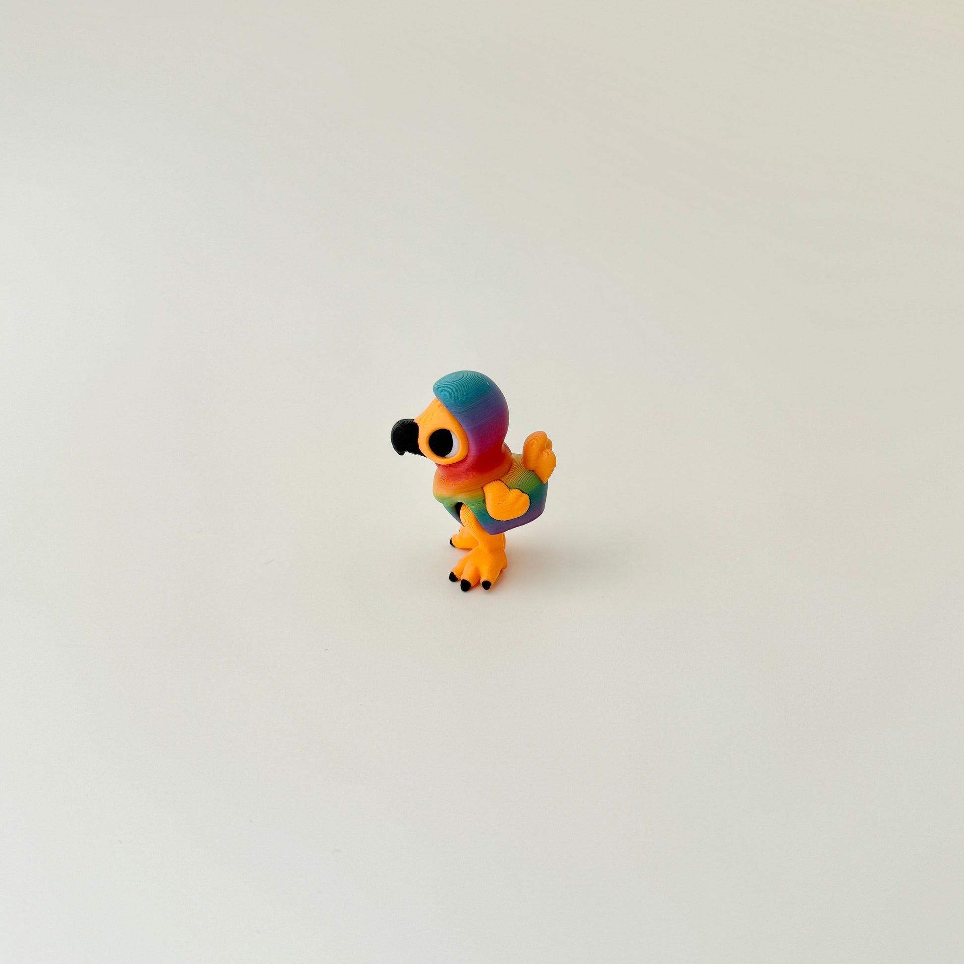 tiny articulated bird toy suitable for sensory regulation and on-the-go use
