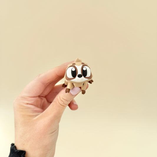 Small, pocket-friendly sloth fidget with detailed features, providing engaging sensory fun for neurodivergent users.