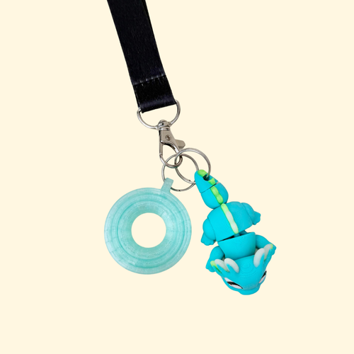 Axolotl lanyard fidget add-on with tactile texture points and flexible movement for calming hands.
