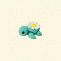 A 5cm teal fidget turtle with a yellow-speckled body and a daisy design on its shell.