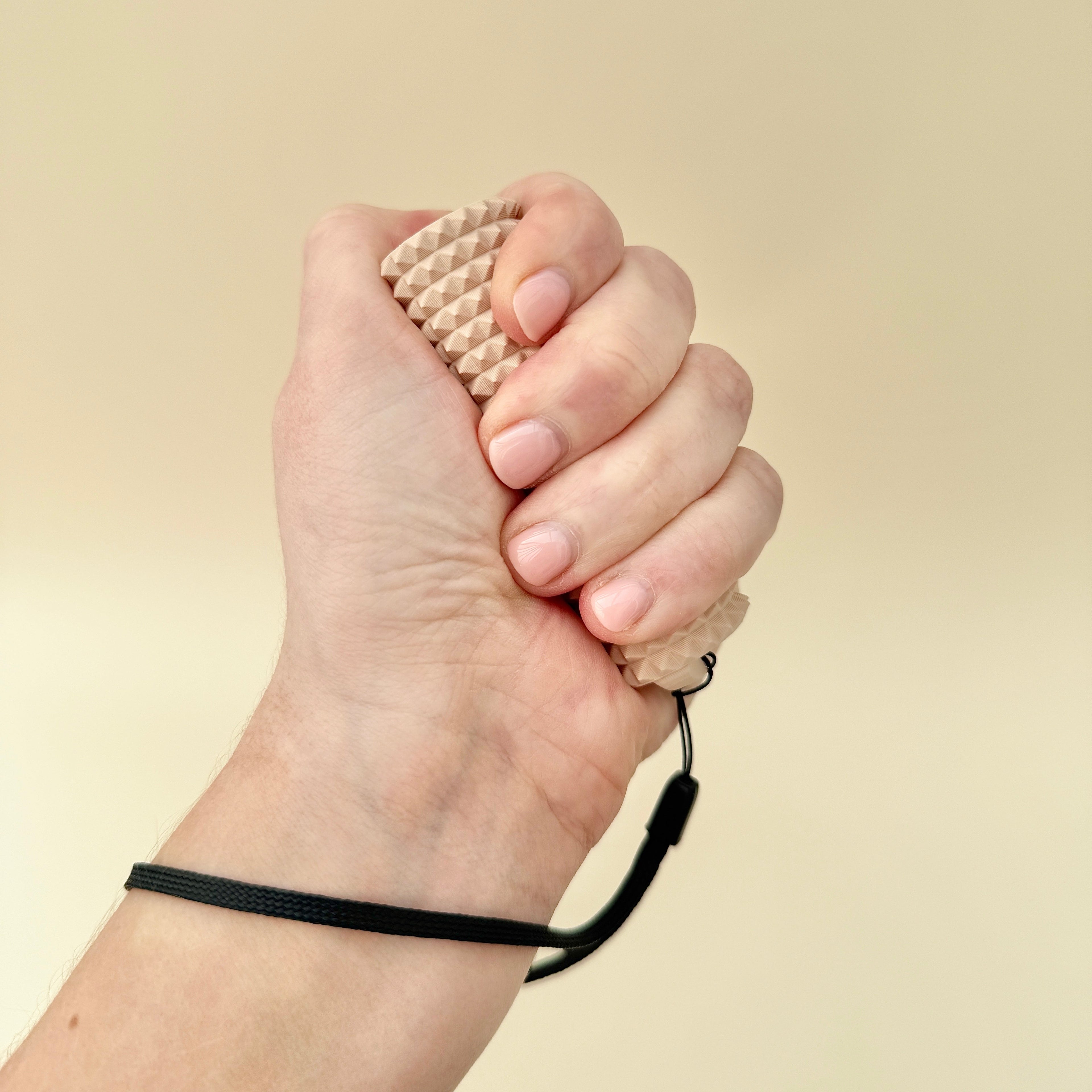 A firm and textured fidget tool designed for tactile stimulation and sensory input.