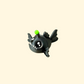 Small articulated fish fidget toy with a metallic finish and glowing green details