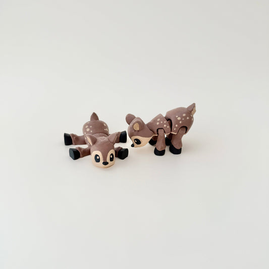 Deer fidget toy shown lying flat, showcasing its detailed body and flexible design.