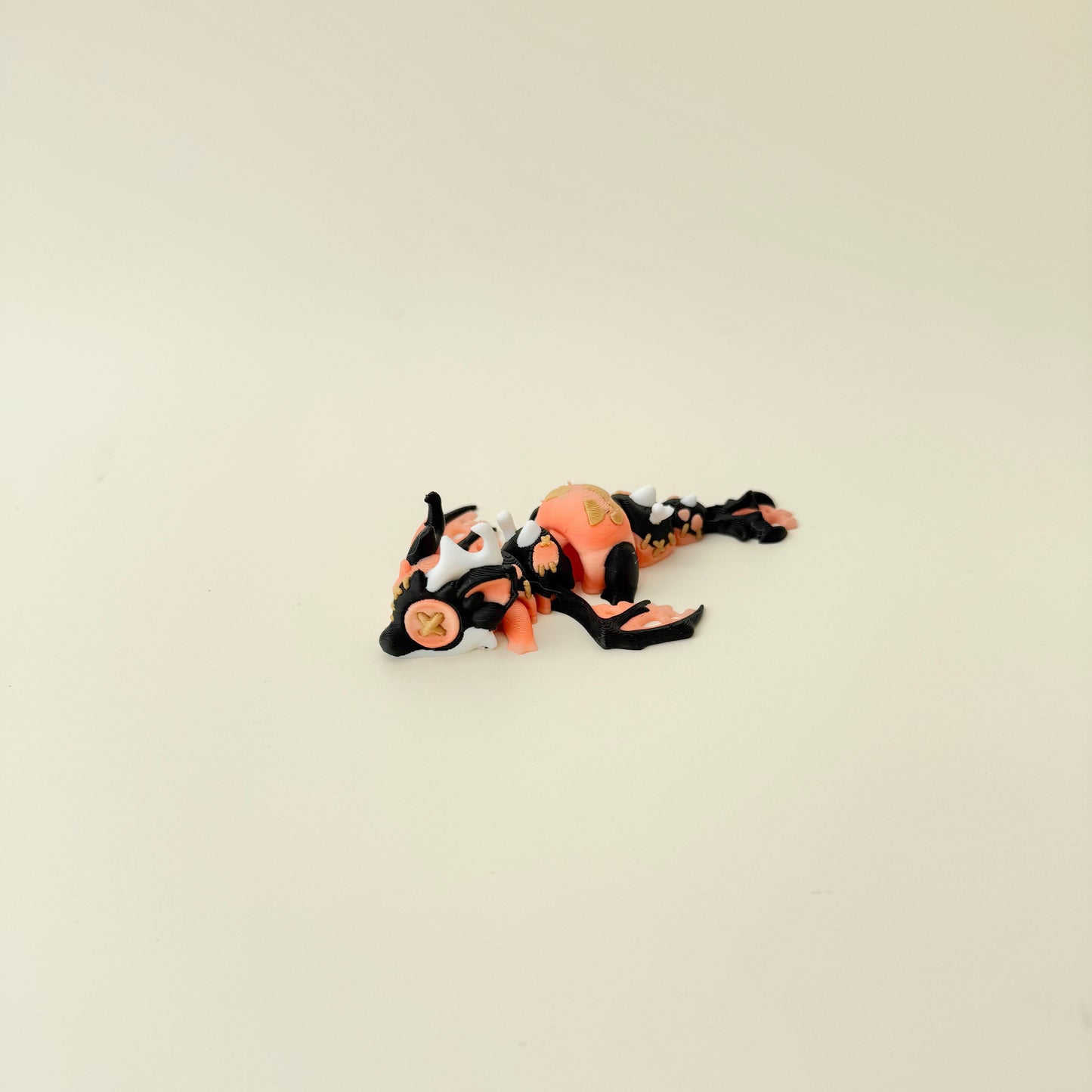 Compact 11 cm dragon designed for display and gentle sensory play.

