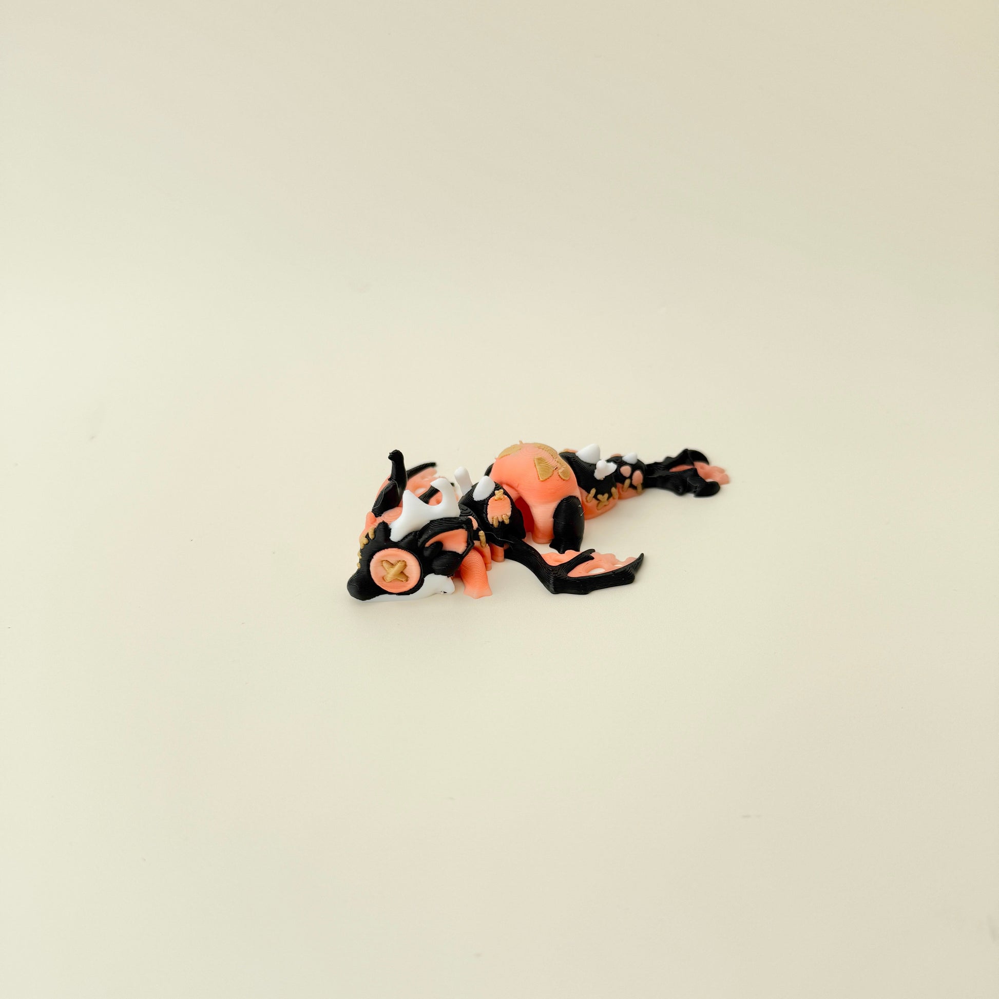 Compact 11 cm dragon designed for display and gentle sensory play.
