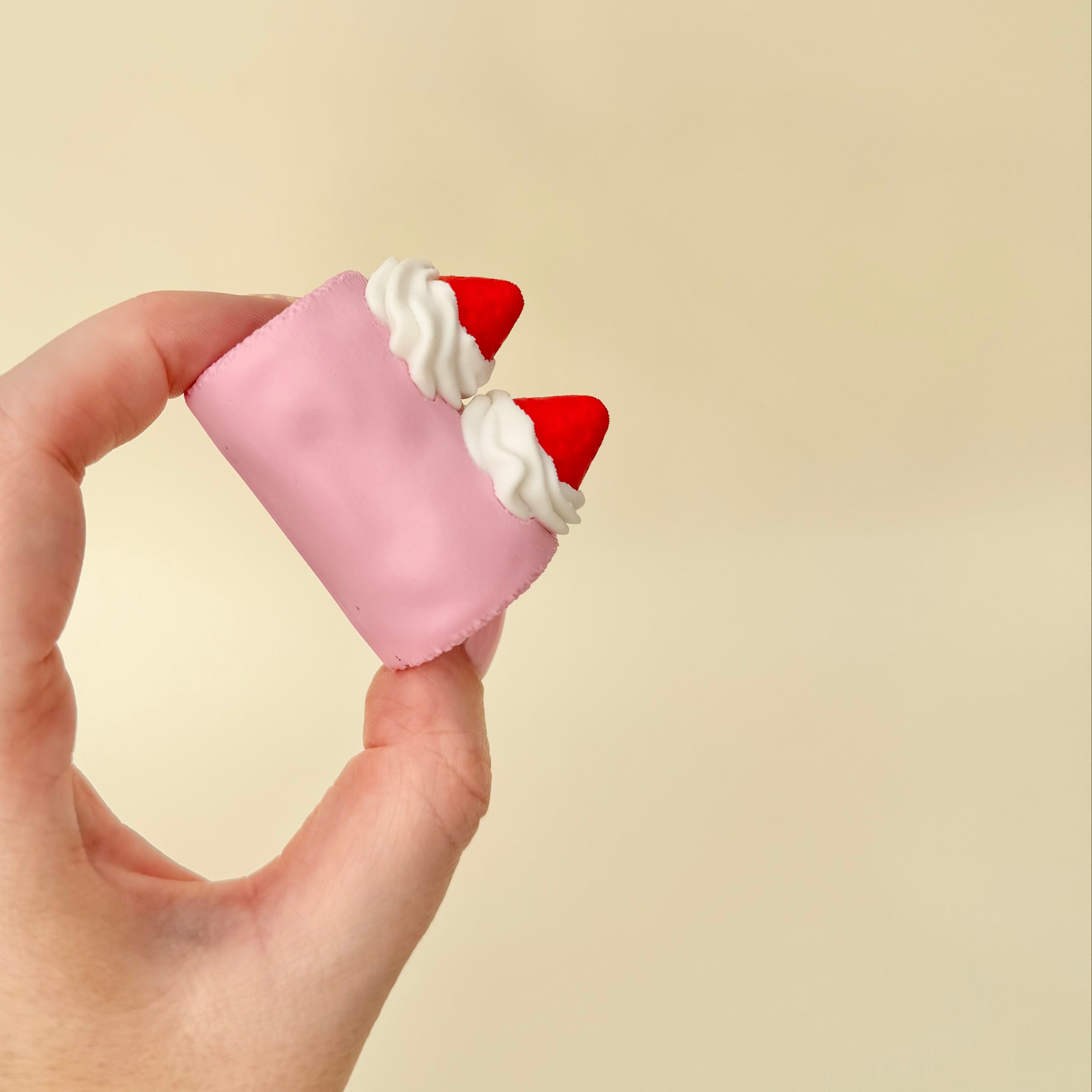 Cute dessert-style clicker fidget that sits nicely on a desk and offers repeated press feedback.
