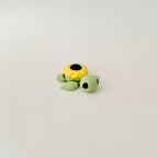 3D-printed turtle toy in soft green and yellow, designed for neurodivergent fidgeters and collectors.
