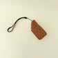 chunky handheld clicker fidget with ridged biscuit texture and soft centre
