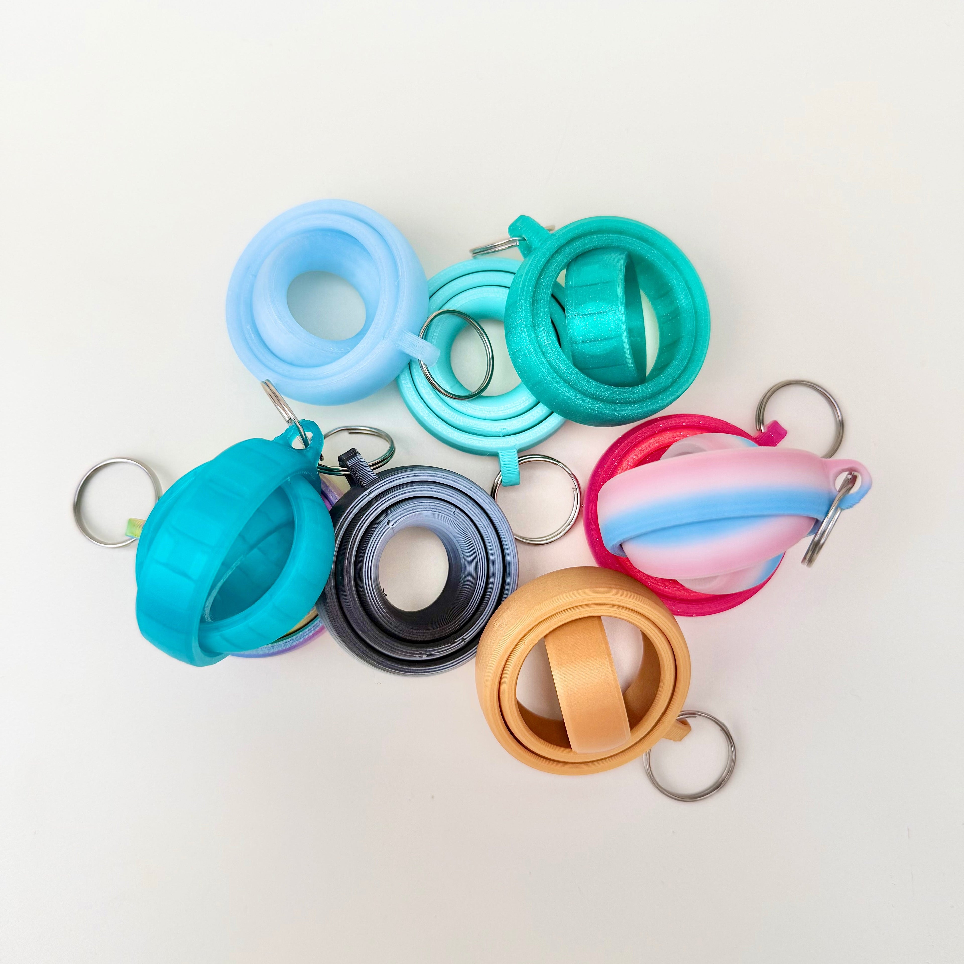 Low-noise spinner fidget that can be used on a lanyard or in-hand, ideal for everyday focus support.
