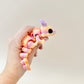 Articulated dragon fidget toy with intricate scales, gradient colours, and detailed features, perfect for sensory play.