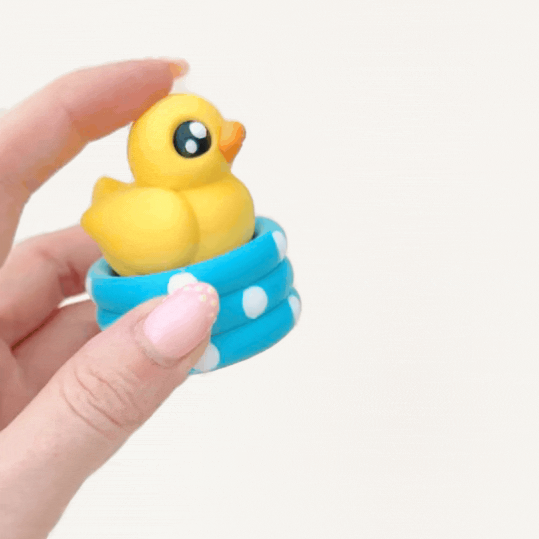 Cute duck pond clicker toy with press action for tactile input, desk play and sensory regulation.