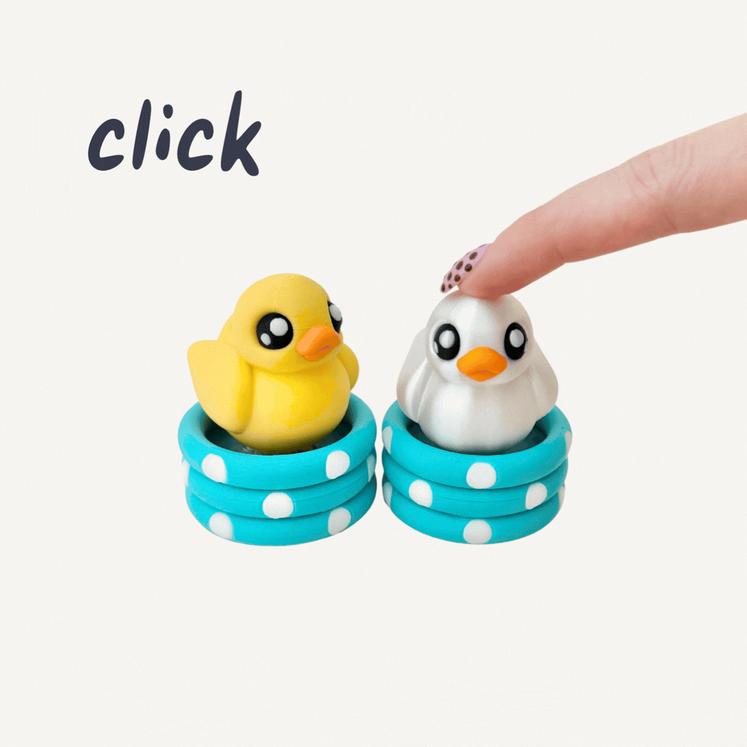 Cute duck clicker toy with pop-down press motion designed for desk fidgeting and sensory play.
