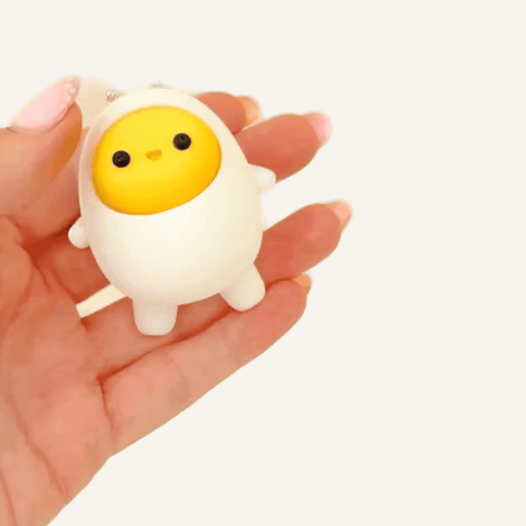 Egg keyring fidget toy with press-button action, choose click or quiet click, ideal for discreet fidgeting and regulation.
