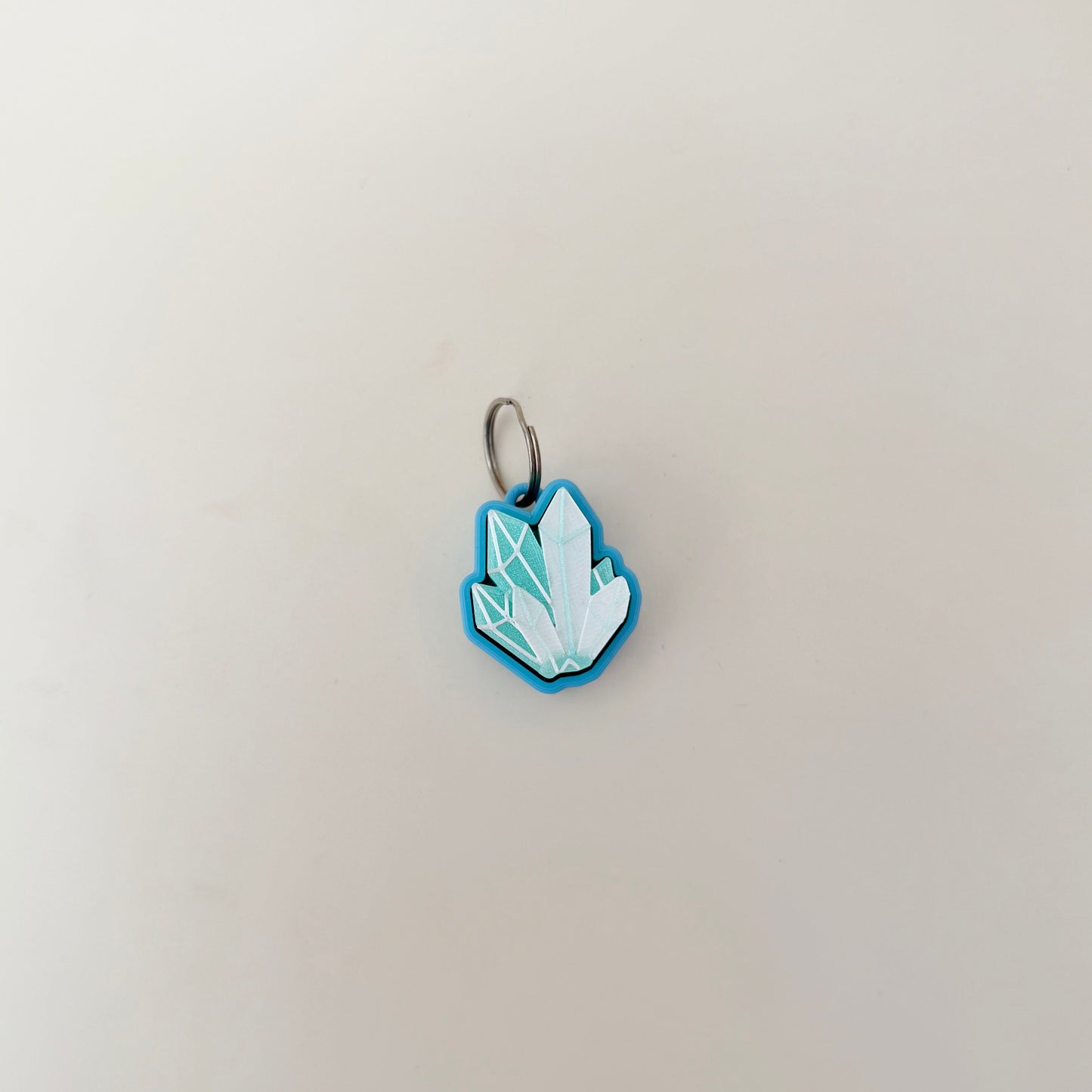 Compact crystal-shape fidget with raised edges; satisfying click action; quiet click upgrade available; everyday carry friendly.