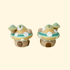 Neutral-toned mushroom-shaped fidget toy with clickable roof
