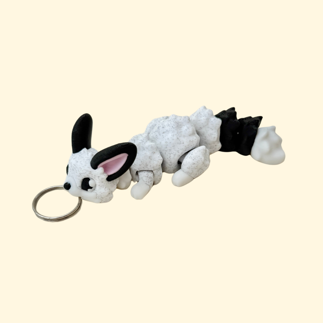 articulated fox fidget with textured surface and keyring loop for sensory use

