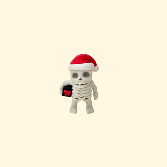 Small articulated Christmas skeleton fidget figure with seasonal colours.
